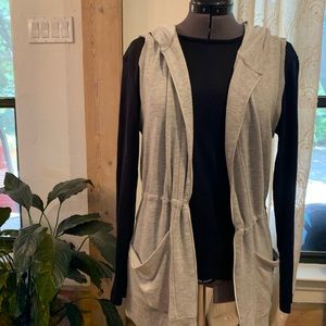 Yogalicious sleeveless grey sweater.